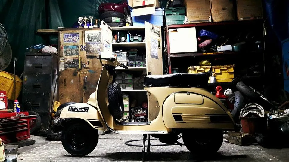 Nazreen Daud's cream classic Vespa Super 150 in a workshop, 2015
